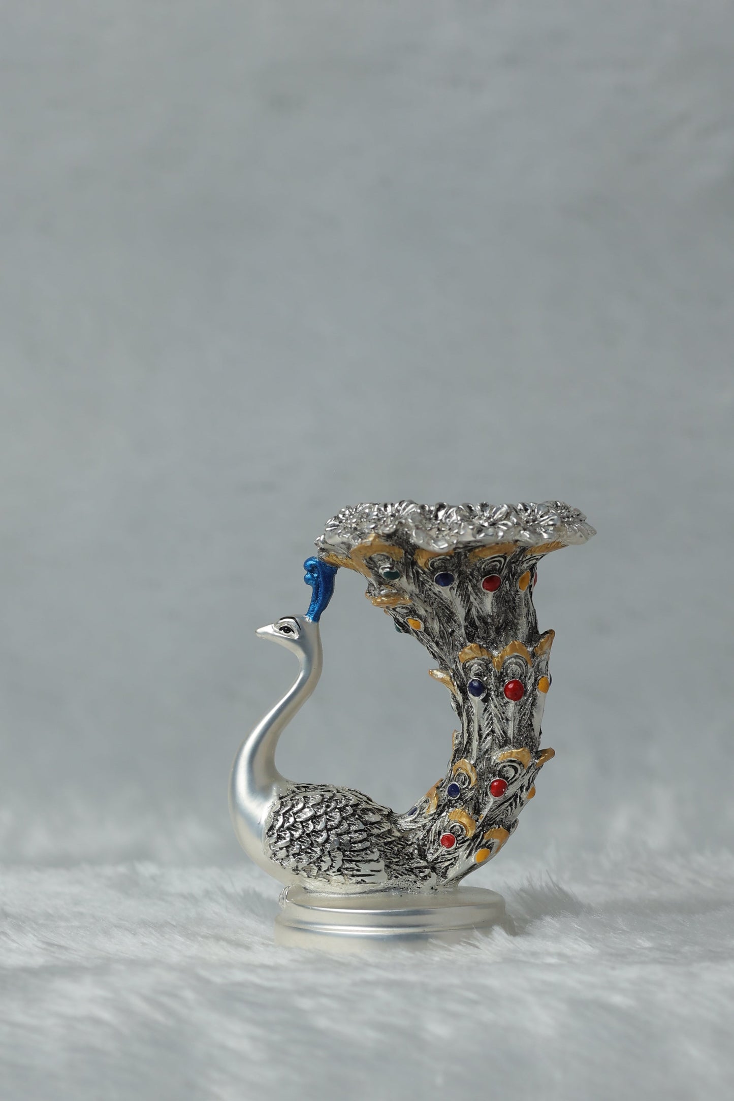 Silver Plated Antique Matt Finish Peacock Candle Holder measures 4*2.5*2.5 inches and weighs 180 grams. Perfect For table top and home decor Dropshiping