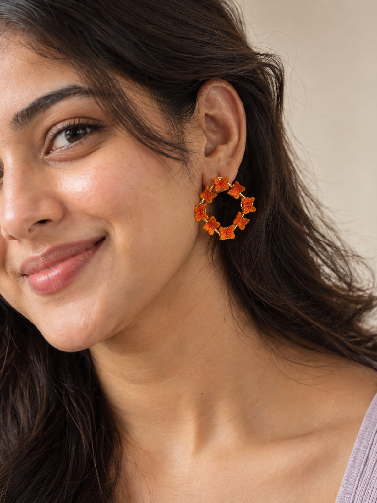 Glitter Butterfly Square Frame Studs Orange on model - Attractive Sister